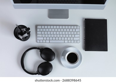 Top View Of Computer, Coffee, Notebook, And Headphones On Office Desk