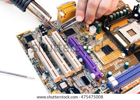 Top view of Comuter electronics repair with soldering Iron. soldering microchips and circuit boards, flat lay, view from above Stock photo © 