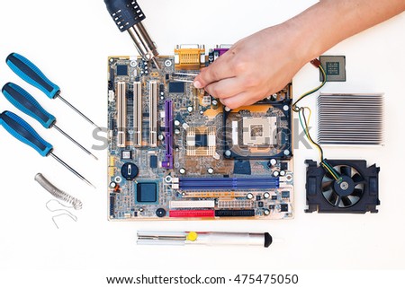 Top view of Comuter electronics repair with soldering Iron. soldering microchips and circuit boards, flat lay, view from above Stock photo © 