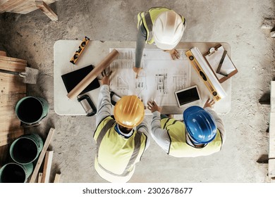 Top view, construction workers or blueprint planning in house, home or office building in real estate, property or architecture innovation. Men, engineering woman or construction site people or ideas - Powered by Shutterstock