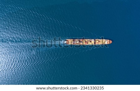 Top view Container ship full capacity approaching  port International Container ship loading, unloading at sea port, Freight Transportation, Shipping,Logistics, import export, Transportation. Globa