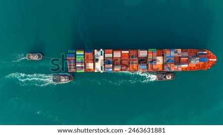 Top view Container ship full capacity approaching the port by a tugboat occupying the port International Container ship loading, unloading at sea port, Freight Transportation, Shipping
