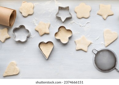 Top view of cooking a gingerbread cookie in the form of heart, star, cloud and flower. Christmas and New Year concept, festive preparations for winter hilodays. - Powered by Shutterstock