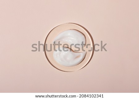 Top view of the cosmetic cream on the acrylic podium,looks like yin yang.Pastel colors,copy space.Good as cosmetics mockup.