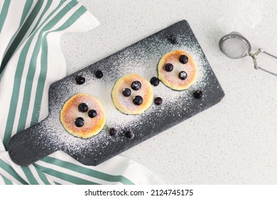 Top View Cottage Cheese Pancakes With Berries Currants On A Serving Board, Plate On Table. Tasty Healthy Diet Food On Breakfast, Lunch, Dinner, Snack