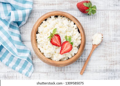 Top View of Cottage Cheese, Tvorog, Curd Cheese on old rustic white wooden background