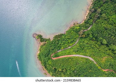 Top View Of Countryside Road Passing Through The Green Forrest And Mountain And Beach