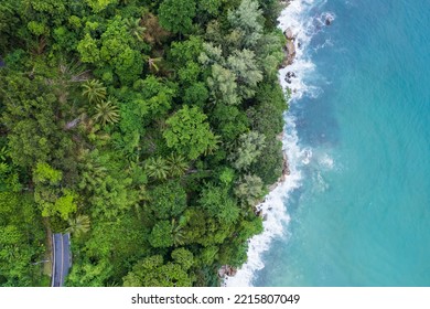 Top View Of Countryside Road Passing Through The Green Forrest And Mountain