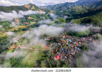 Top View Of Countryside Road Passing Through The Green Forrest And Mountain