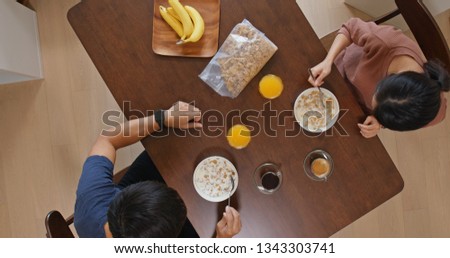 Top view of couple having breakfast at home
