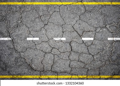 Top View Of Cracked Alphalt Concrete Road With Highway Line Marks For Road Transportation Background.