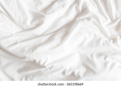 Top View Of The Crease Of An Unmade Bed Sheet In The Bedroom After A Long Night Sleep And Waking Up In The Morning.