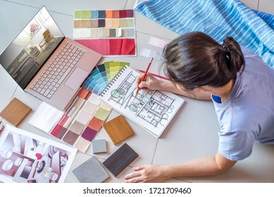 Top view of creative freelancer (Architect -Interior designer) lie down on the floor, drawing illustration on sketchbook, items set of labtop & material sample / Work from home concept - Powered by Shutterstock