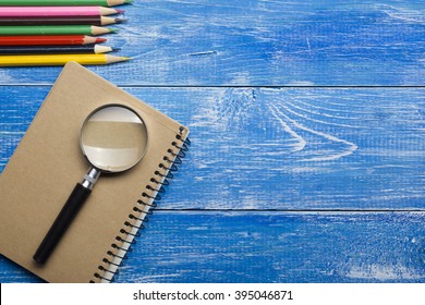 Top View of Creative Writing Concept With Pencils, Book, Notepad on Wooden Table. Copy space for text