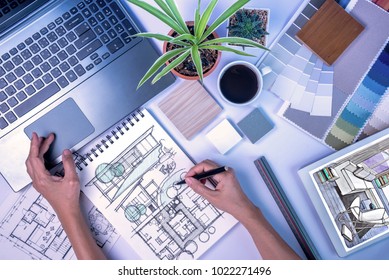 Top view of creative's (architect & interior designer) working at desk with laptop, tablet, drawing sketch / Home renovation & decoration concept