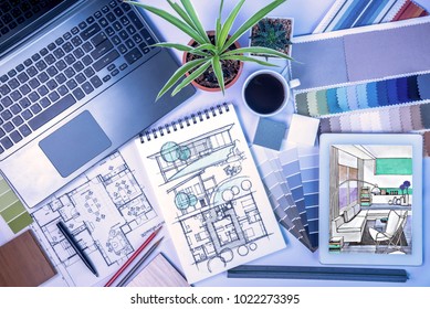 Top view of creative's (architect & interior designer) desk with laptop, tablet, drawing sketch / Home renovation & decoration concept