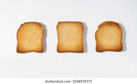 Top view of crispy wholemeal crackers bread rusks different shaped toast slices isolated on white background