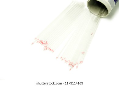 Top View And Crop Of Medical Capillary Glass Tube Spread And Container On White Background., Designed For Both Safe Blood Collection As Well As Accurate Micro-hematocrit Determinations Precision.