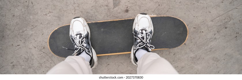 Top View Of Cropped Man In Sneakers Standing On Skateboard, Banner