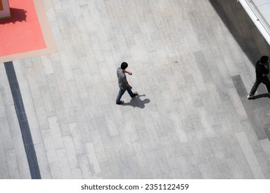 Top view crowd of people walks on a business street pedestrian in the city - Powered by Shutterstock