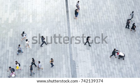 Top view crowd of people walks on a business street pedestrian in the city