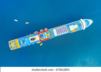 Top View Of A Cruise Ship And Boats In The Blue Sea