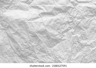 Top View Of Crumpled White Paper For The Background. Light And Soft Color Background, Large Crumpled Paper Background Texture For Art Design. The Surface Is Not Smooth But Attractive.