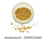 Top view of Crushed Peanuts in a white bowl and scattered on isolated white background. Crumbled Roasted Nuts, Heap of Pea Nut Crumbs. Ground, milled, crushed or granulated peanut pile isolated.