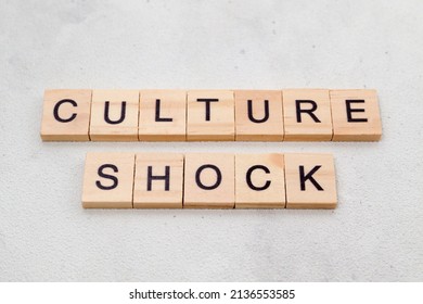 Top view of Culture Shock word on wooden cube letter block on white background. Business concept