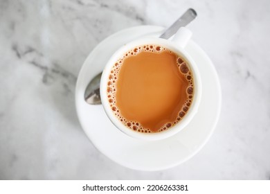 top view of cup of milk tea on table  - Shutterstock ID 2206263381