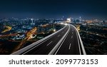 Top view and curvy of Highway overpass with beautiful city background. night scene.