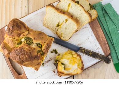 Top View Of Cut Jalapeno Cheese Bread On A Cutting Board.