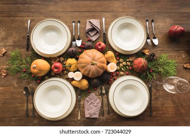 Top View Of Cutlery And Autumn Decor On Table Served For Thanksgiving Dinner