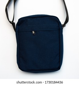 Top View Of Dark Blue Messenger Bag On White Background, Copy Space, Mockup