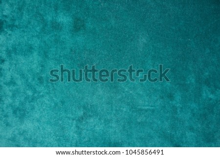 Top view of dark green velour fabric