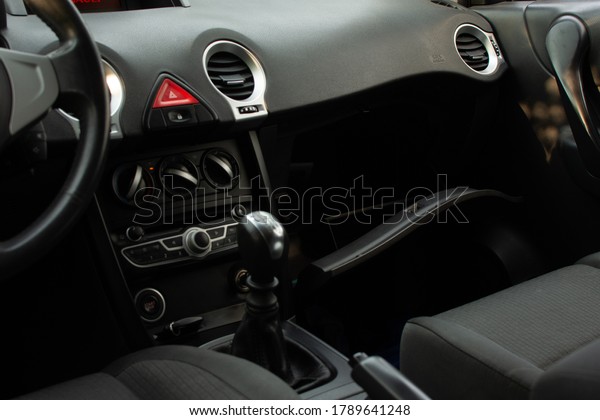 top view of the dashboard and interior of a car with\
the glove box open