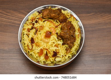 Top View Of Delicious Arabian Mutton Dum Biriyani,  Made With Basmati Rice, Spices. Yogurt, Pickle Side Dish  For Ramadan, Eid Festival Saudi Arabia, Dubai.