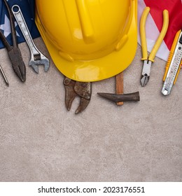 Top view design concept of American Labor Day with working tools on gray table background. - Powered by Shutterstock