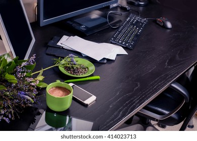 Top View Of Desktop. Home Office. Work At Home. Personal Belongings On A Black Table. Against The Dark Wood. Good Morning Pleasant Working. 