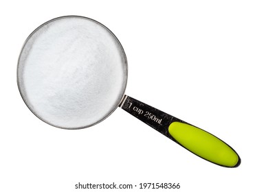 Top View Of Dextrose Crystalline Sugar In Measuring Cup Cutout On White Background