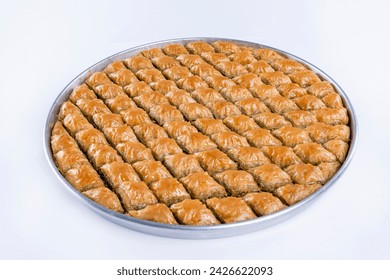 Top view of diamond cut pistachio baklava on a tray isolated on white background. - Powered by Shutterstock