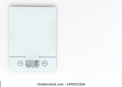 Top view of digital kitchen scale on white