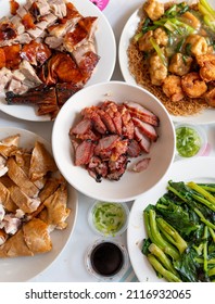 Top View Of A Dining Table With A Spread Of Meat And Vegetable Dishes For A Holiday Feast.