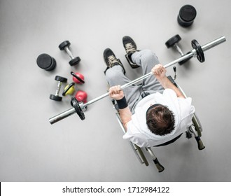 Top View Of Disabled Man In Wheelchair Working Out