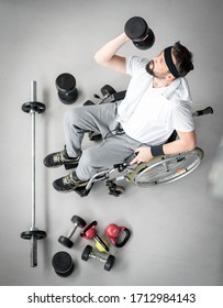 Top View Of Disabled Man In Wheelchair Working Out