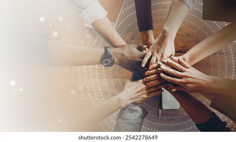 Top view of diverse group of hands stack, coming together for business teamwork. This image symbolizes teamwork, collaboration, and community spirit. This image emphasizes business teamwork. - Powered by Shutterstock