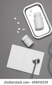 Top View Of Doctor Desk Table With Stethoscope And Medical Items. Flat Lay.