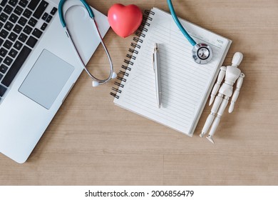 Top View Of Doctor Workspace With Stethoscope And Personal Equipment On Table Desk, Above View Of Doctor Working Space At Clinic Hospital. Health Medical Occupation And Business Healthcare Concept