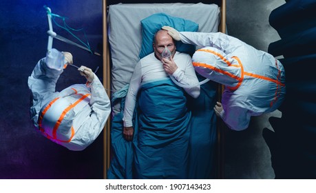 Top View Of Doctors And Covid-19 Patient With Oxygen Mask In Bed In Hospital, Coronavirus Concept.