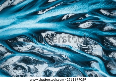 Top view of dramatic abstract icelandic glacier river delta flowing through rugged landscape in Highlands of Iceland